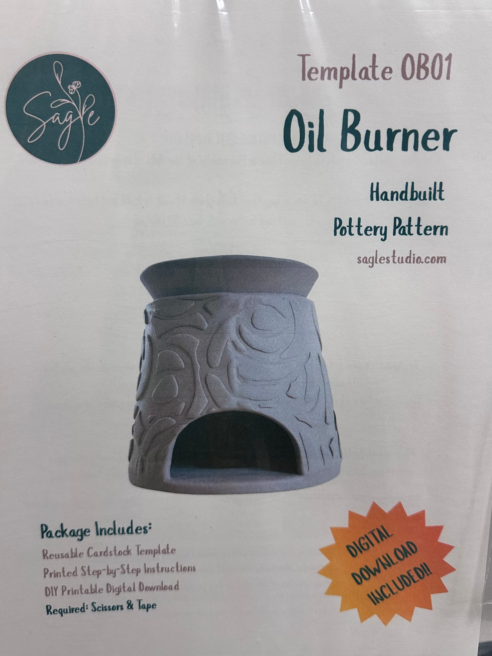 Oil burner packaging with branding and product details on a white background